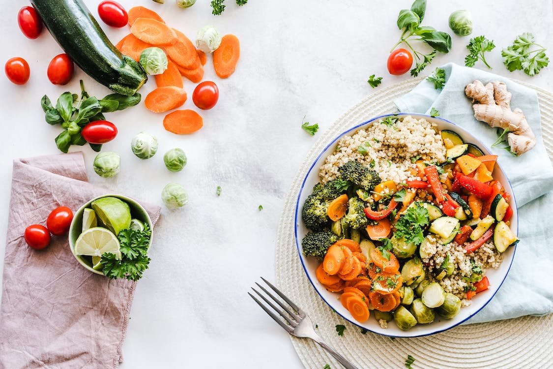 "Vibrant plate of balanced diet - showcasing a variety of colorful fruits, vegetables, grains, and proteins. The image represents essential nutrients, expert tips, and the path to healthier living and optimal wellness through a well-balanced diet."